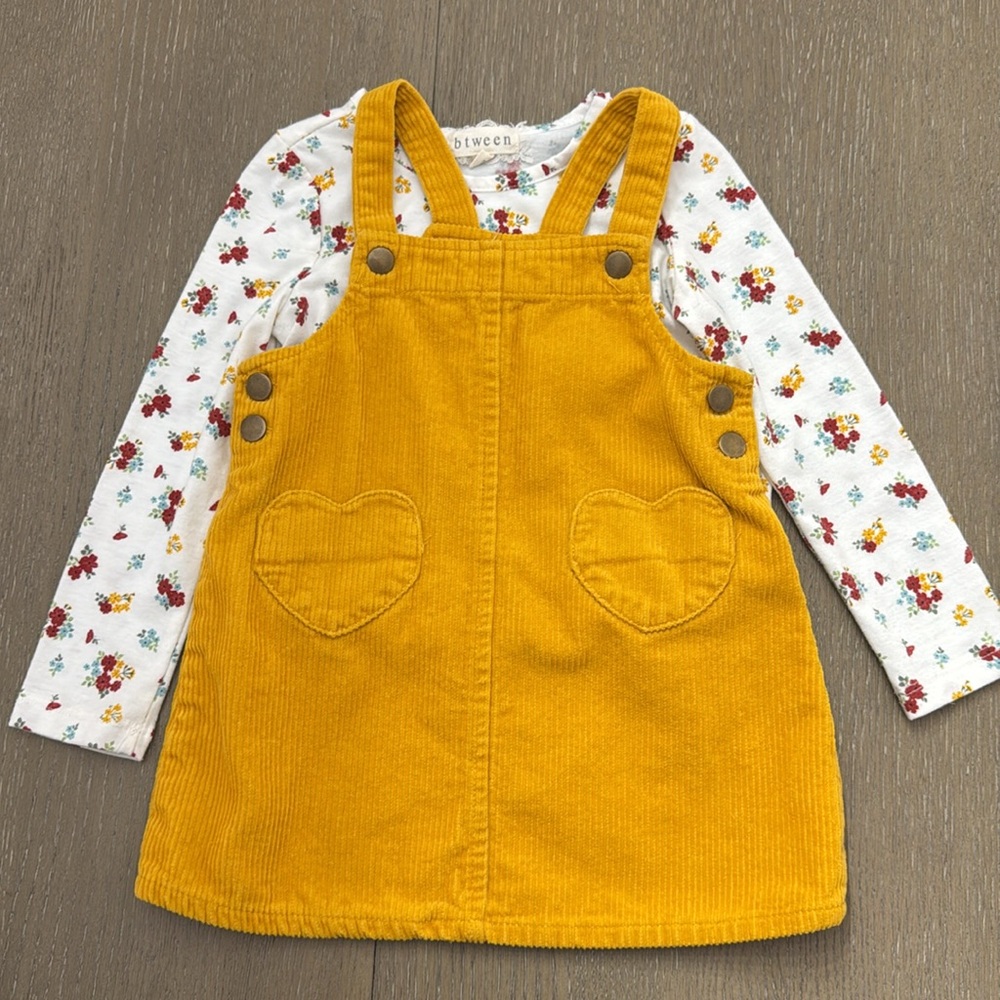 Goldish yellow corduroy jumper with heart pockets, and floral top